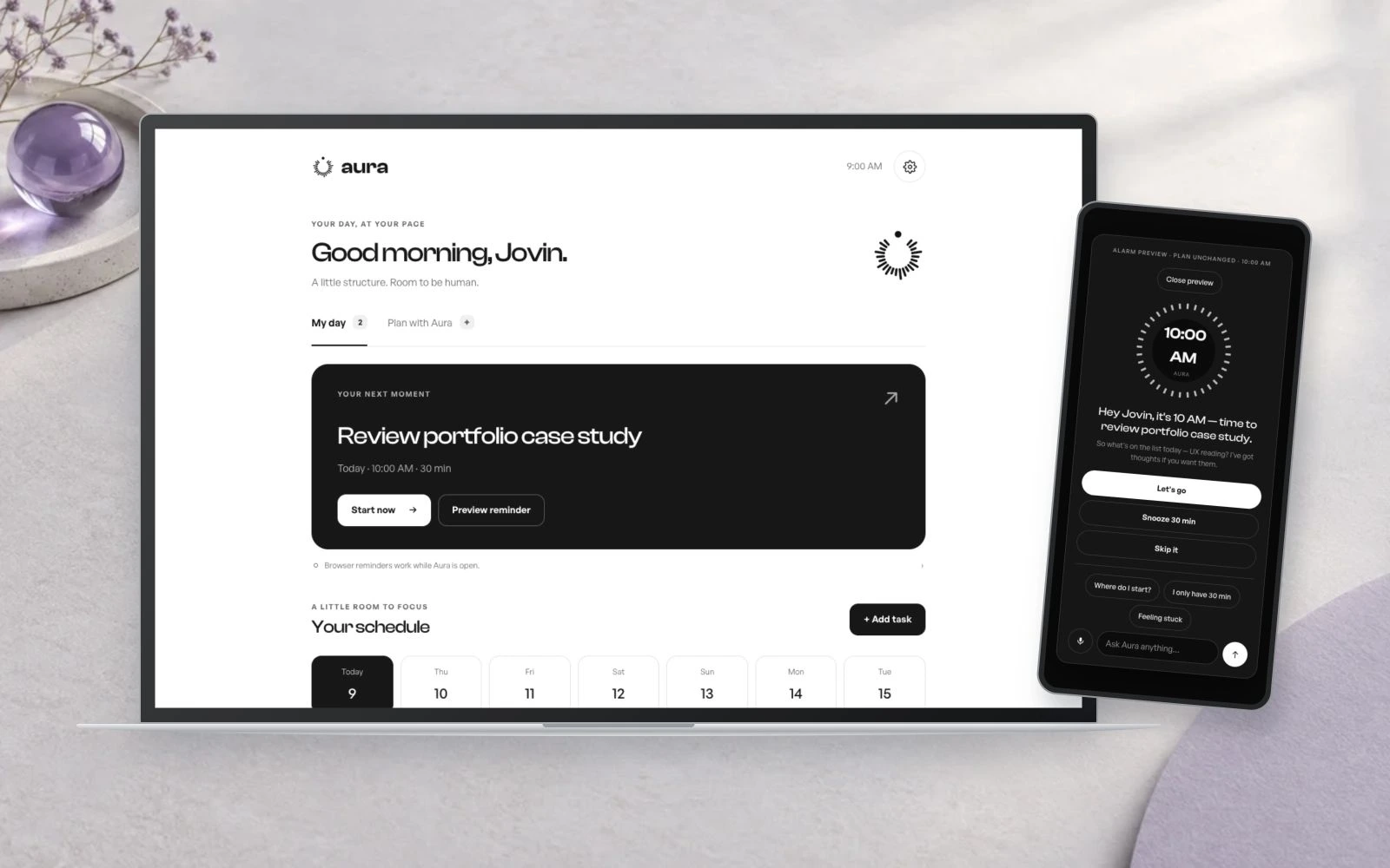 Aura daily planning on a laptop with its mobile reminder preview in a lavender setting